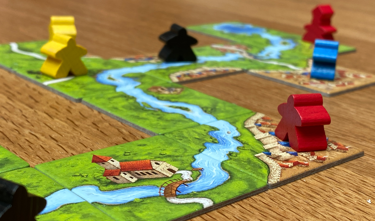 The Tiles and Meeples of Tabletop Boardgame Carcassonne with a Roads ...